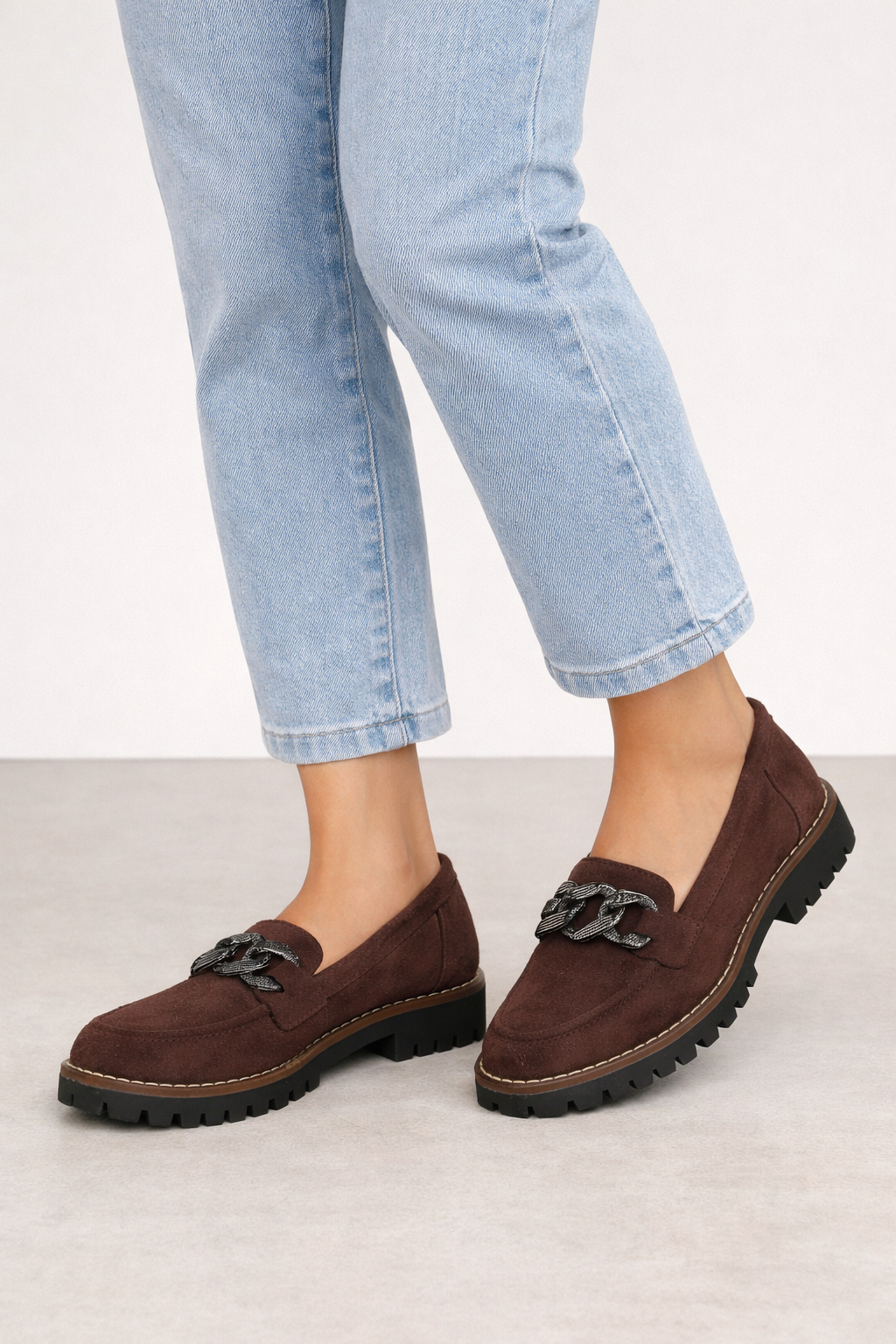 Chocolate brown chunky chain loafers worn with light blue jeans Adeline