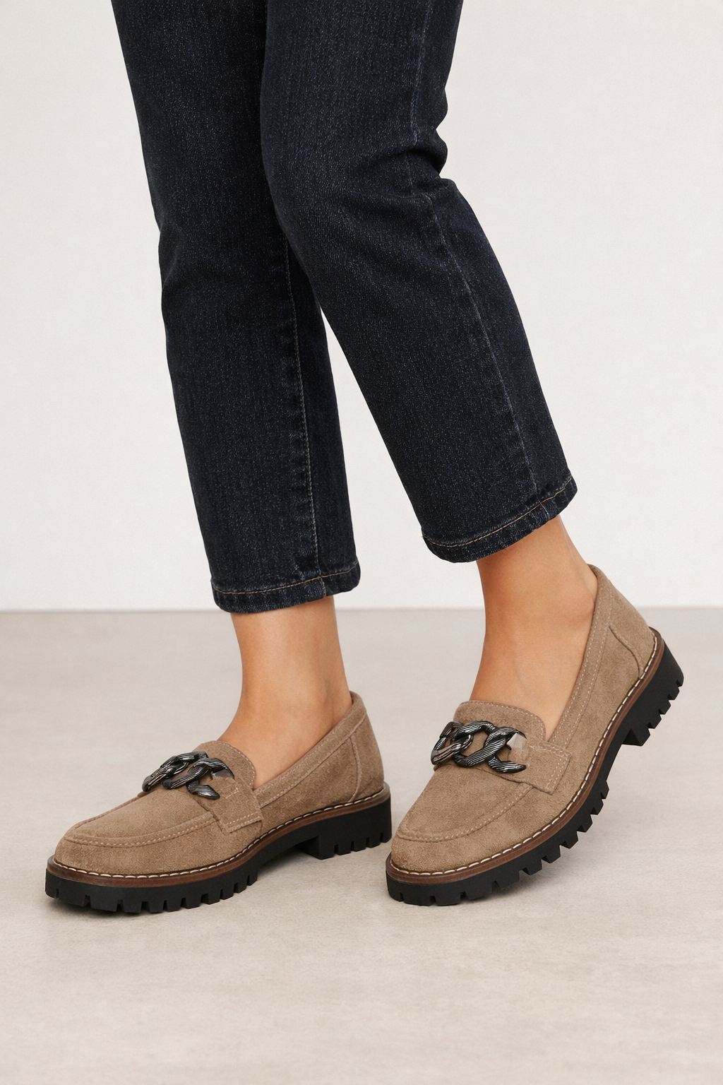 Taupe chunky chain loafers worn with dark jeans Adeline